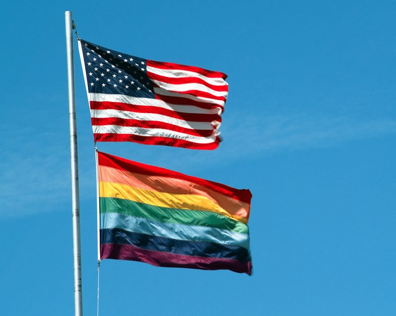 Pride flag below the American flag