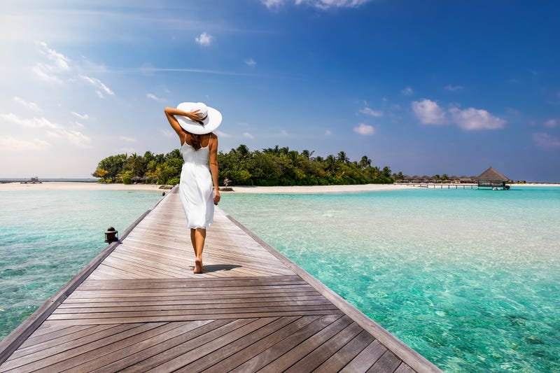 woman on dock in tropical location