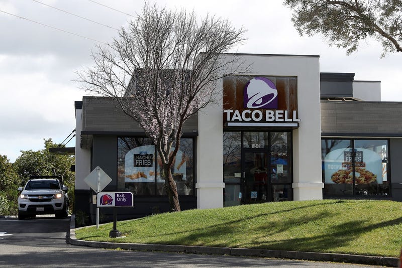 A car goes through a drive thru at a Taco Bell restaurant on February 22, 2018 in Novato, California.