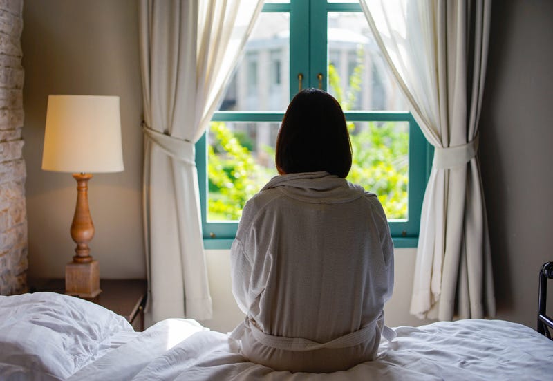 Woman alone in bed