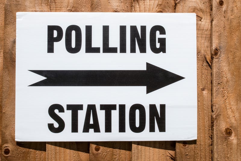 A sign pointing in the direction of a Polling Station on election day