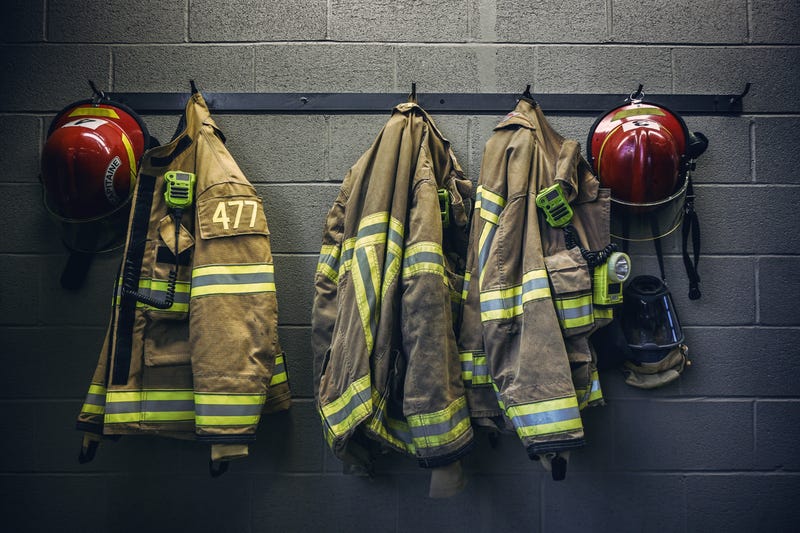 firefighter gear hanging on wall