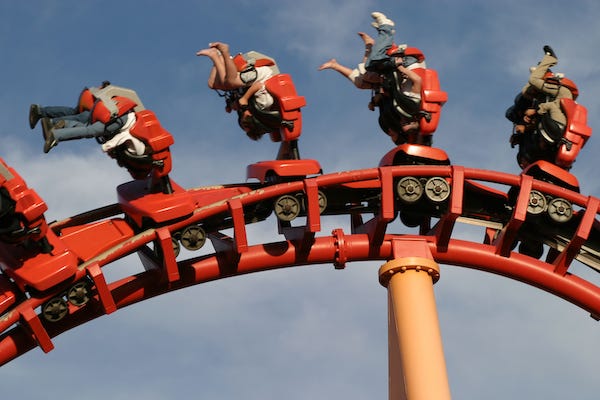Roller coaster hanging riders upside down