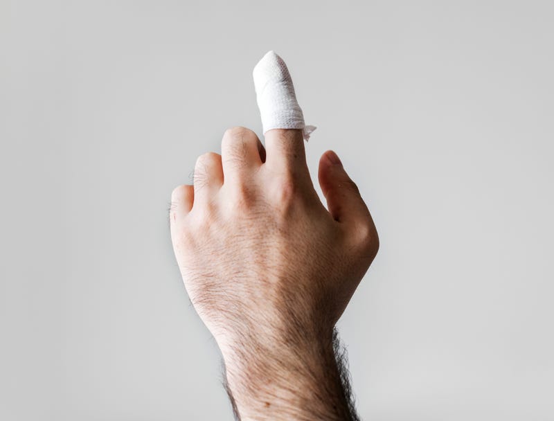 Stock photo. Hand with bandaged finger. 