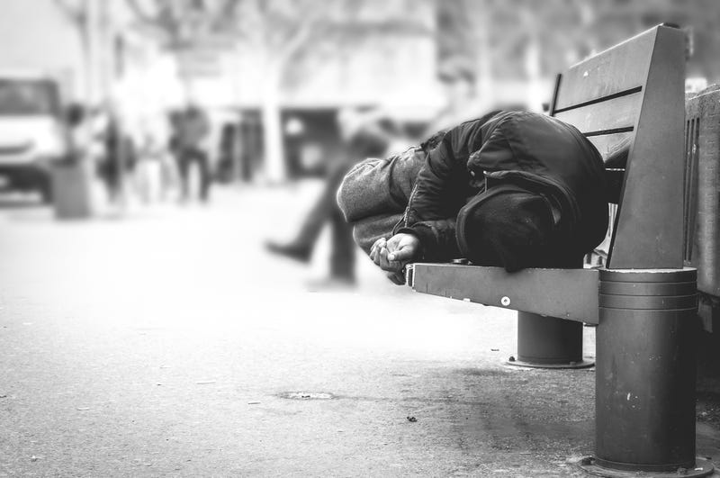 Homeless sleeping on bench