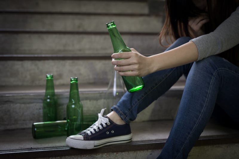 depressed woman feel upset with alcoholism problem and sit in underground road