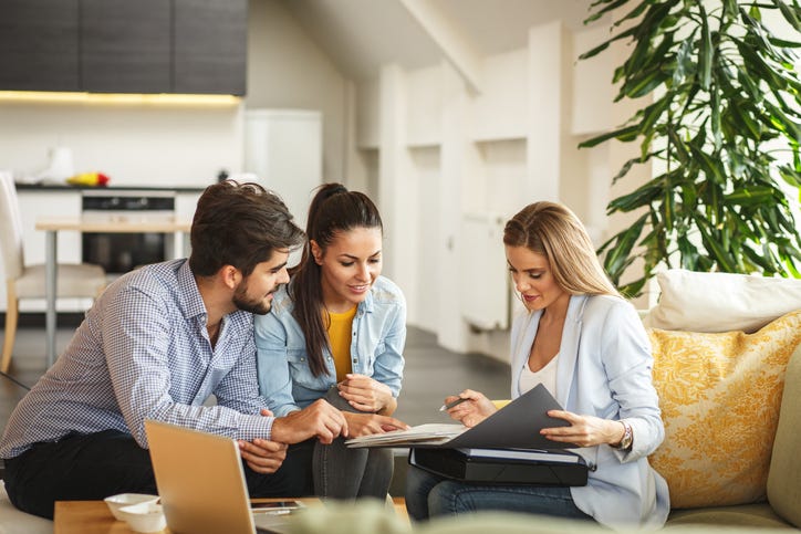 Couple with real estate agent