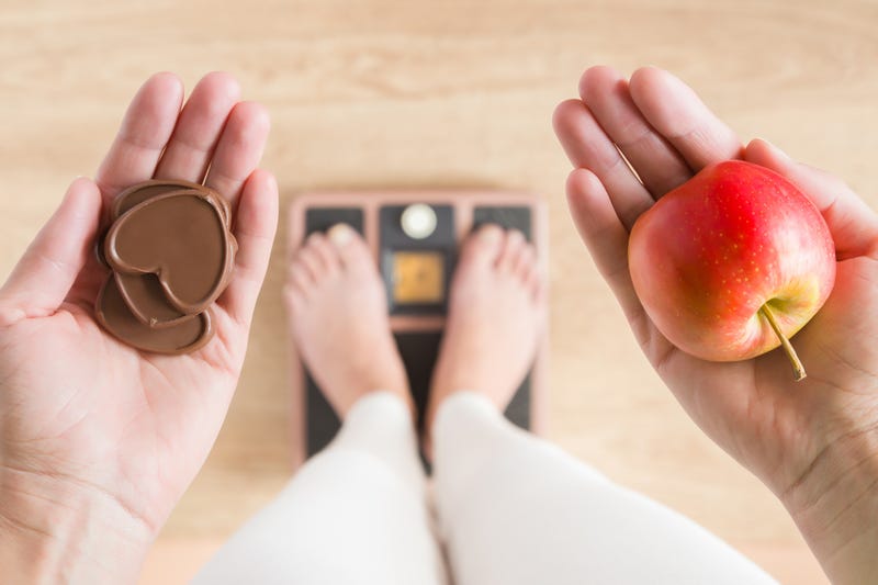 person holding food on scale
