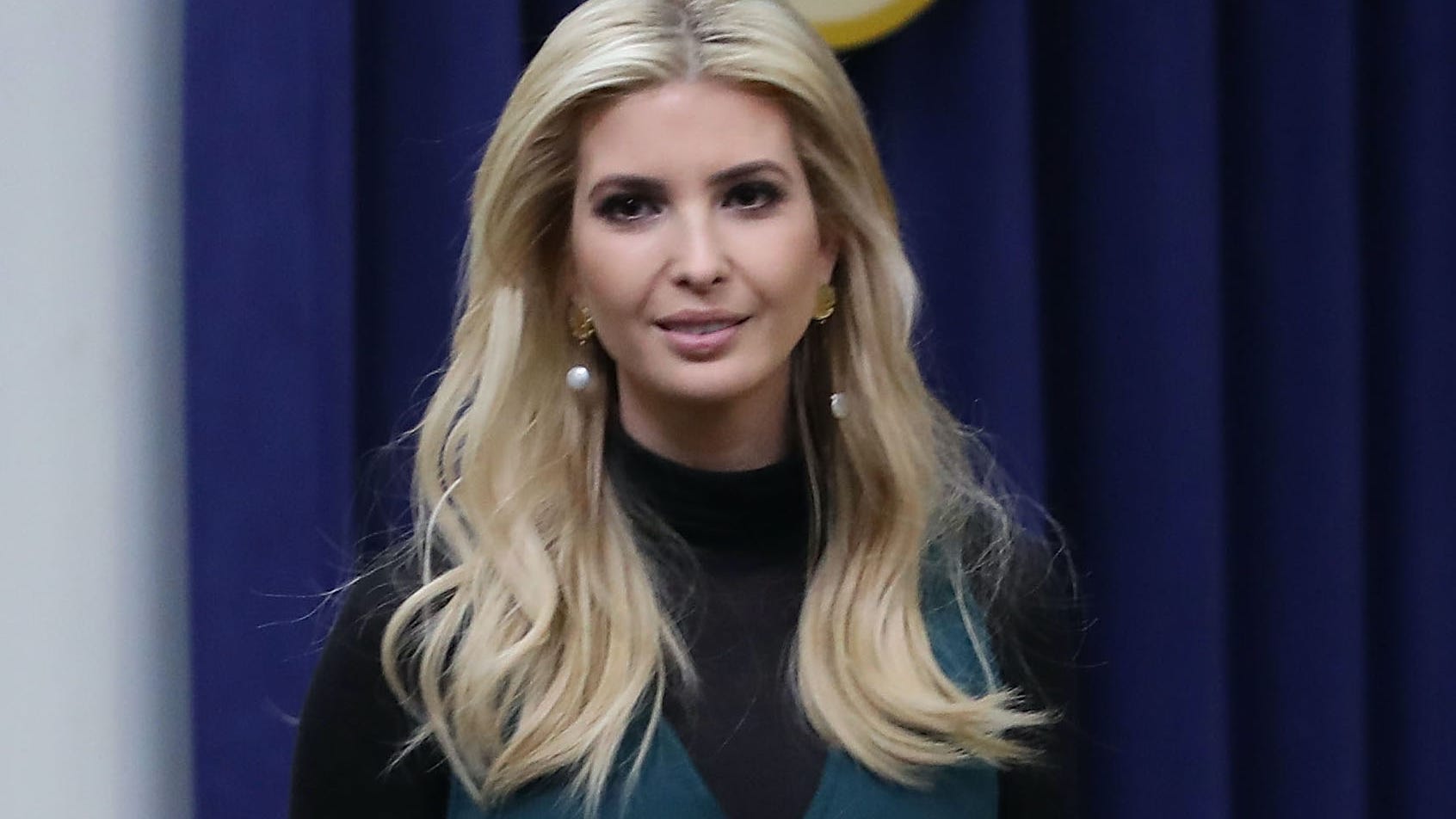 Ivanka Trump displays toned abs in sports bra and leggings on beach stroll