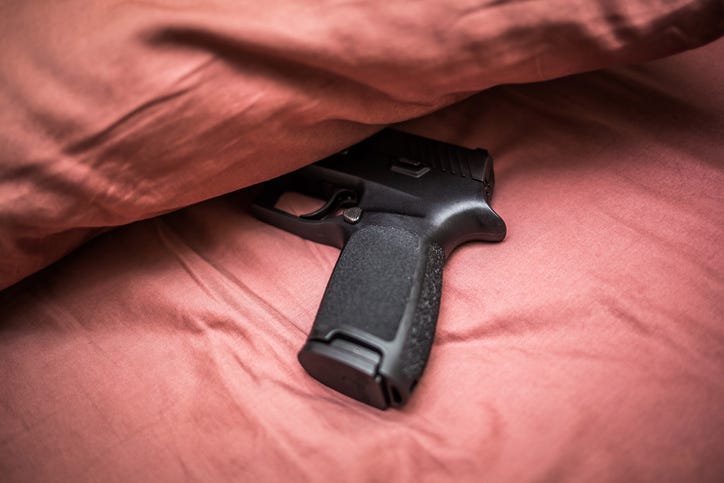 gun on bed