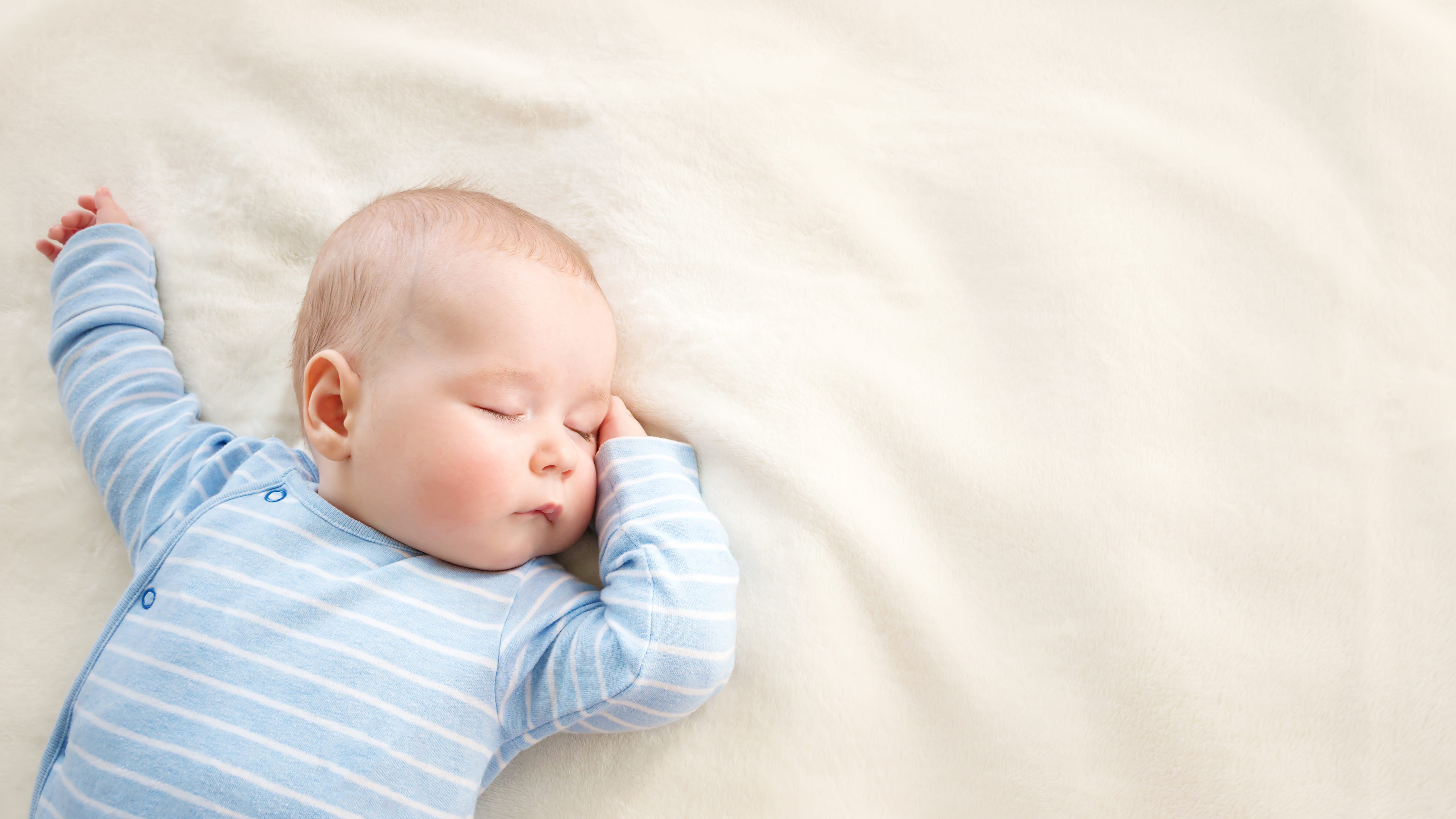 FDA approves device to help keep babies sleeping on their backs, prevent death