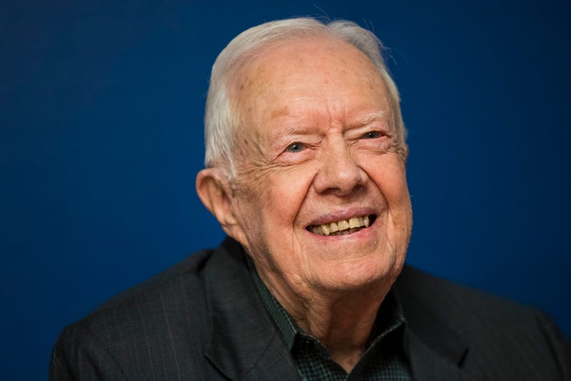 Former President Jimmy Carter smiles during a book signing event for his book 'Faith: A Journey For All' at Barnes & Noble bookstore in Midtown Manhattan on March 26, 2018