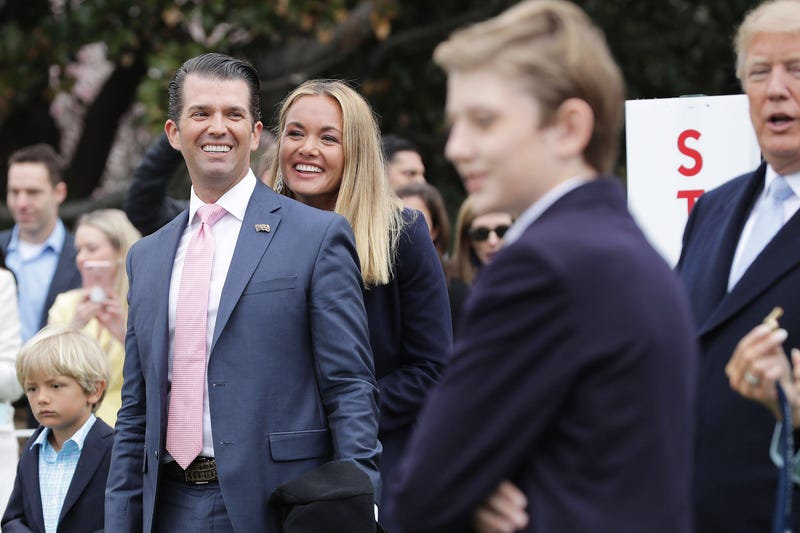 Donald Trump Jr. (L) and his wife Vanessa Trump attend the 140th annual Easter Egg Roll with their five children, Barron Trump and President Donald Trump (R) on the South Lawn of the White House April 2, 2018 in Washington, DC.