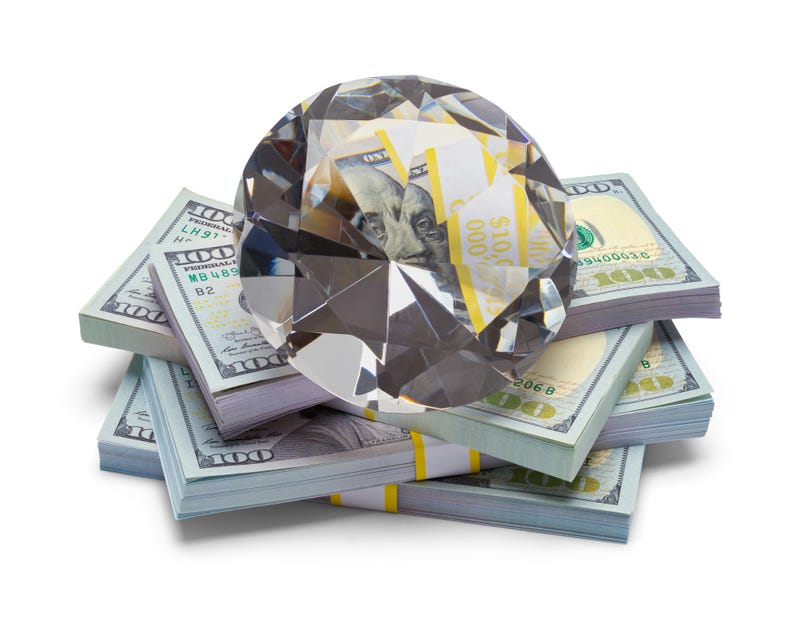 Pile of Money with a Large Diamond Isolated on a White Background.