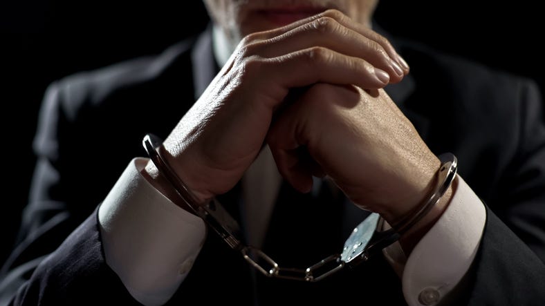 businessman in handcuffs