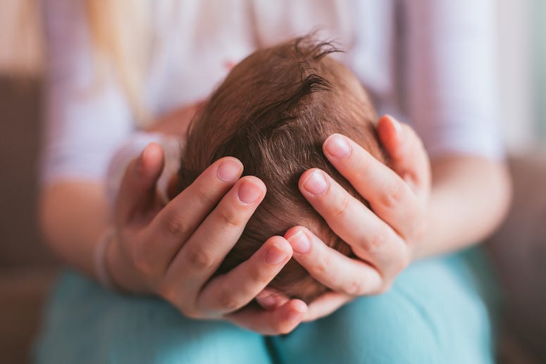 Mom holding newborn baby