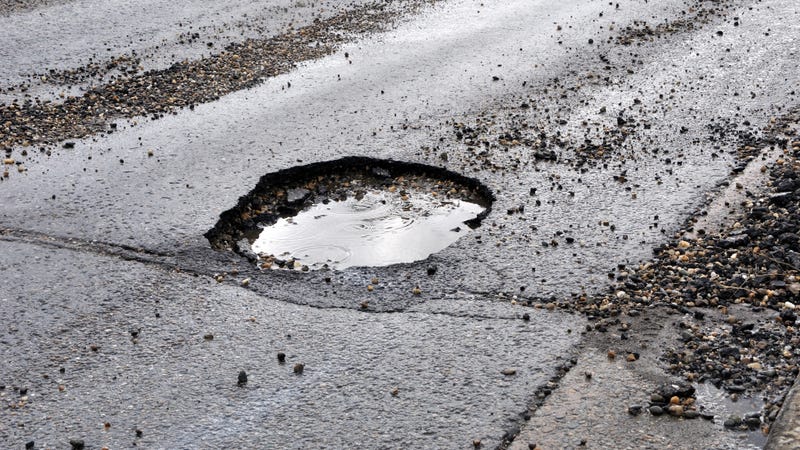A pothole on an asphalt road