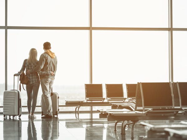 Couple embracing each other at the airport