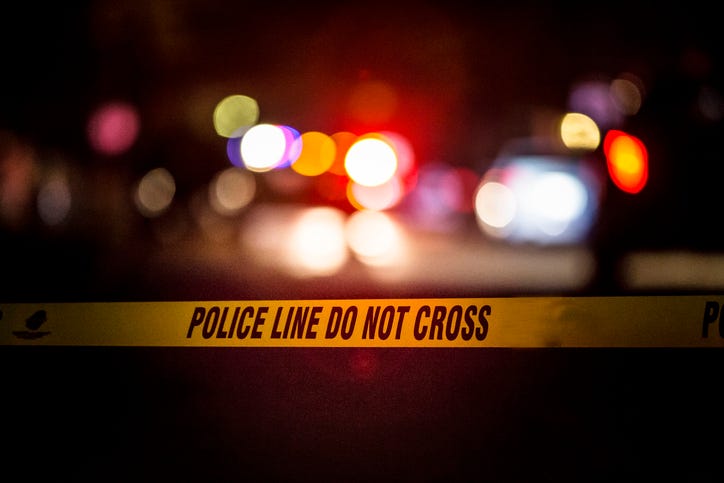 A crime scene in suburban Royal Oak, Michigan is marked off by police crime scene tape.