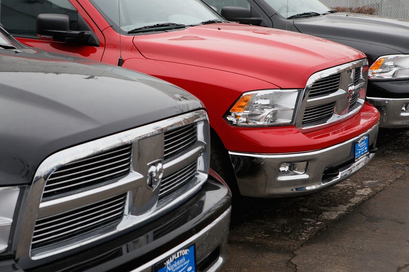 Front ends of Dodge Ram trucks in a row