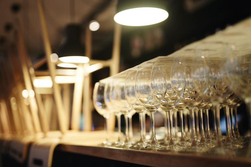 Wine glasses and stacked chairs