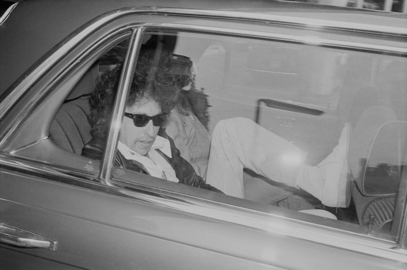 Dylan sitting inside a car in 1978, right around the time he purchased Minneapolis' famous Orpheum Theater.