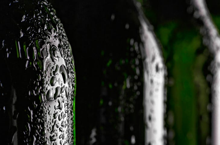Close up of a soda bottle in hot weather. 