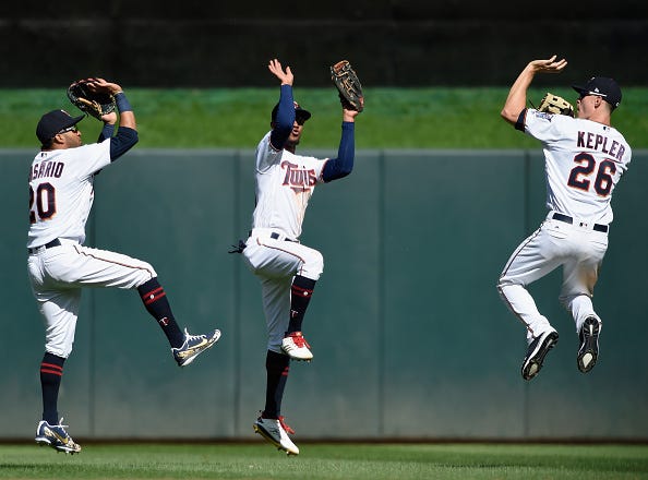 Eddie Rosario #20, Byron Buxton #25 and Max Kepler #26 of the Minnesota Twins celebrate defeating the Milwaukee Brewers 3-1 after the interleague game on May 20, 2018 at Target Field in Minneapolis, Minnesota. 