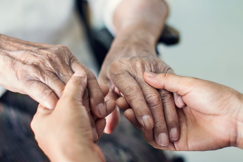 Close up hands of helping hands elderly home care