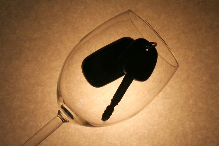 wine glass with a car key