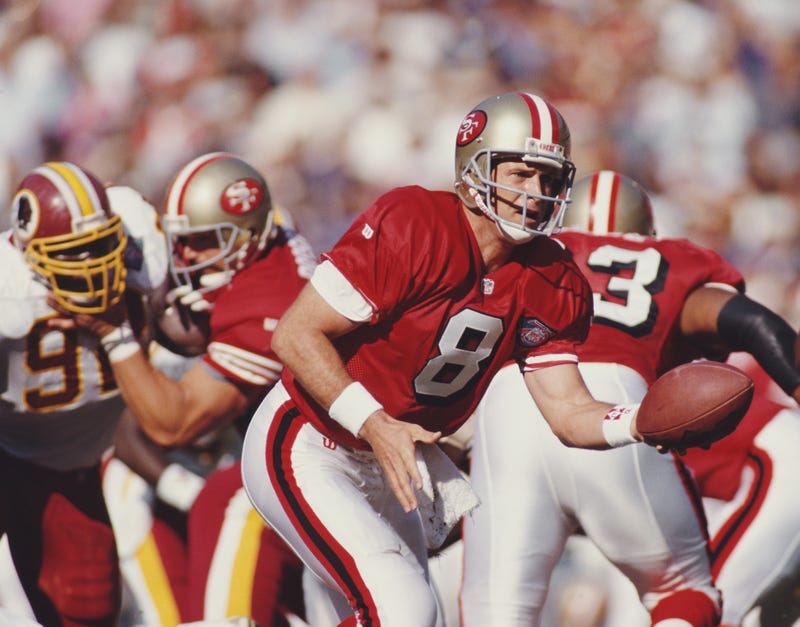 Steve Young running a play for the san francisco 49ers