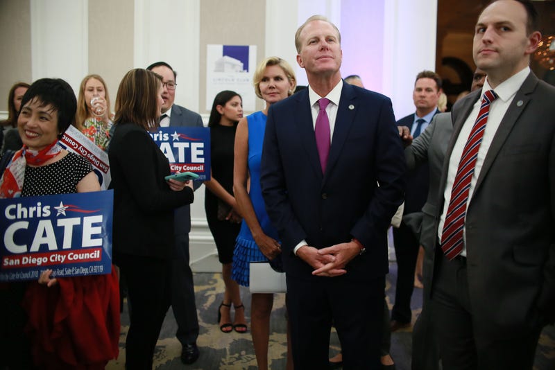 San Diego Mayor Kevin Faulconer, middle, listens to speakers during an election eve party at the U.S. Grant Hotel in San Diego, California on Tuesday, June 5, 2018.