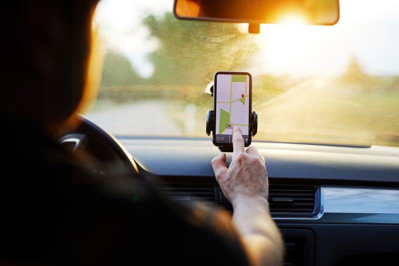 Driver using navigation system in car