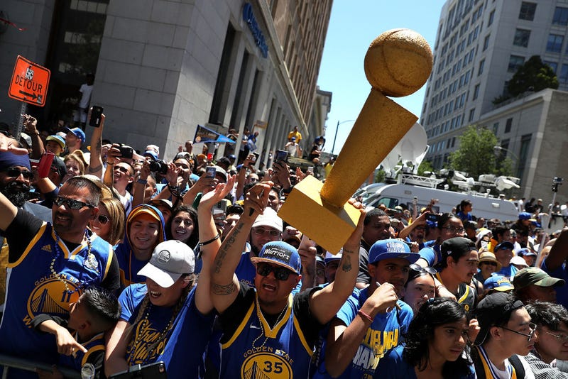  Golden State Warriors fans line the parade route during the Golden State Warriors Victory Parade on June 12, 2018 in Oakland, California.
