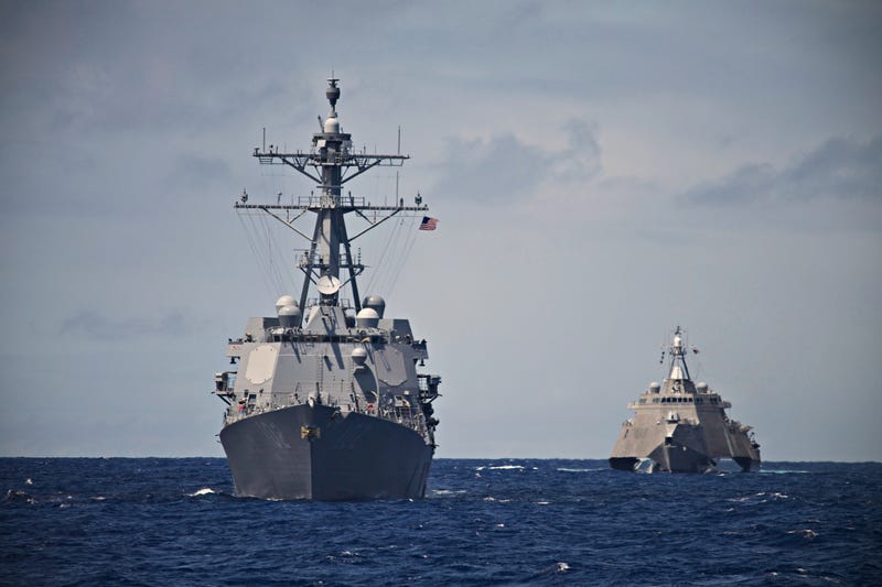 A USS Destroyer and Littoral Combat Ship hunt together in the South Pacific. Taken during a Pacific Deployment in 2014.