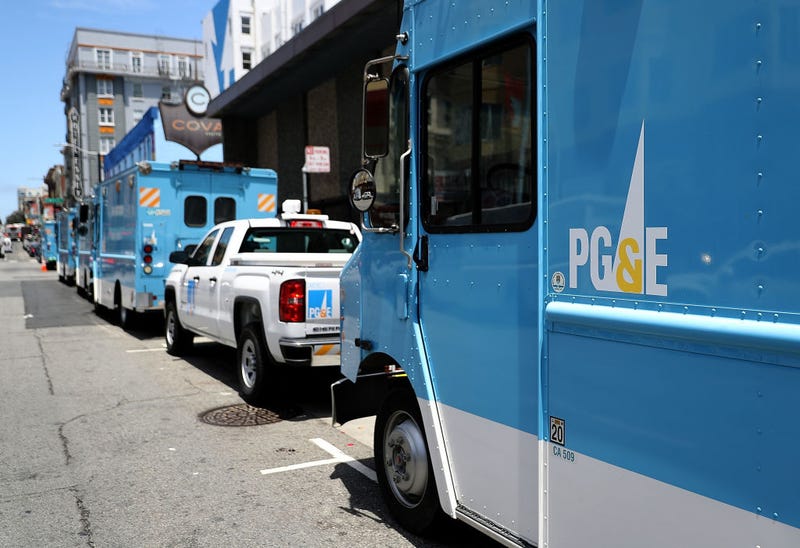 Pacific Gas and Electric (PG&E) trucks sit parked on a street on June 18, 2018 in San Francisco, California.