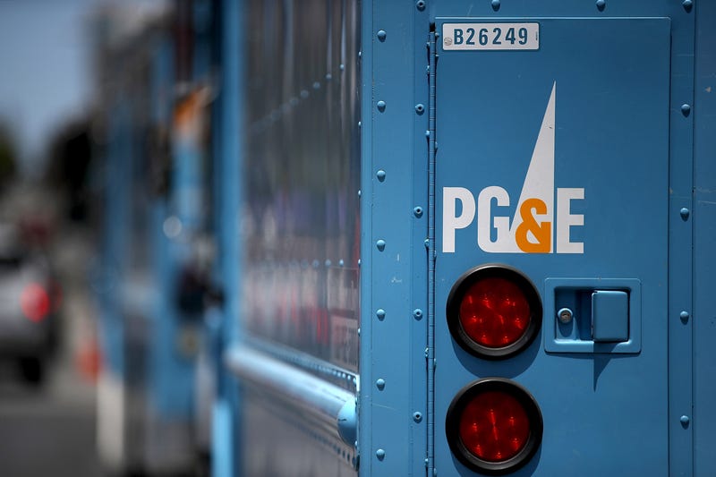Pacific Gas and Electric (PG&E) trucks sit parked on a street on June 18, 2018 in San Francisco, California.