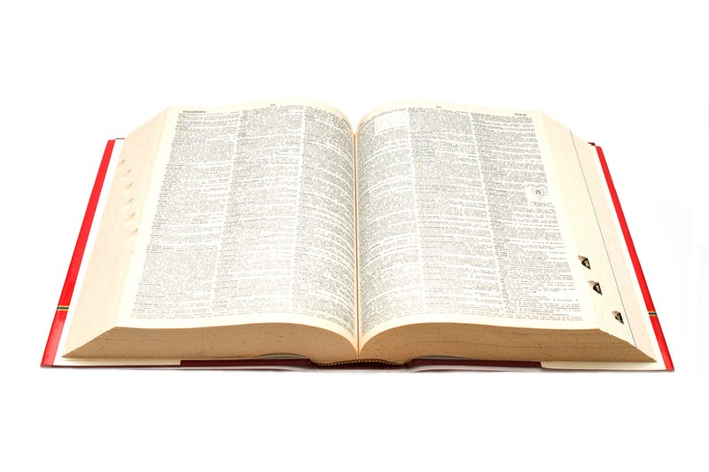 A dictionary open on a table. 