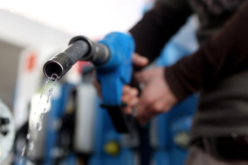 In this photo illustration a man refuels his car on March 23, 2010 in Munich, Germany.