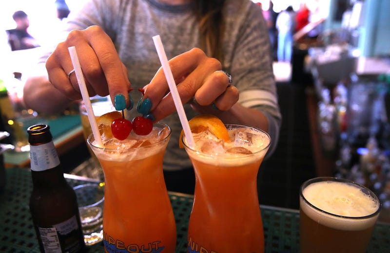 Drinks with plastic straws at a bar