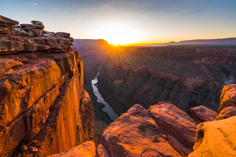 The sun rises over the north rim of the Grand Canyon.