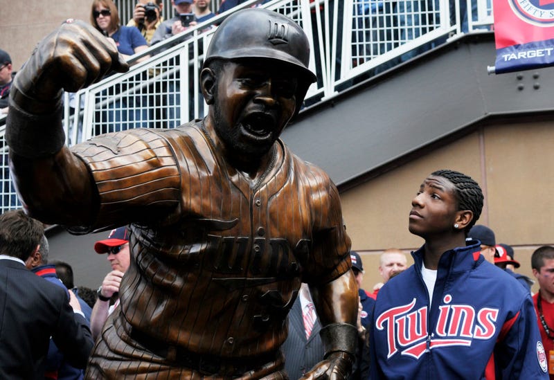 Kirby Puckett, Jr., son the late Minnesota Twins of Hall of Famer Kirby Puckett, looks at a statue of his father after it was unveiled prior to a game between the Boston Red Sox and the Minnesota Twins during the Twins home opener at Target Field on April 12, 2010 in Minneapolis, Minnesota.