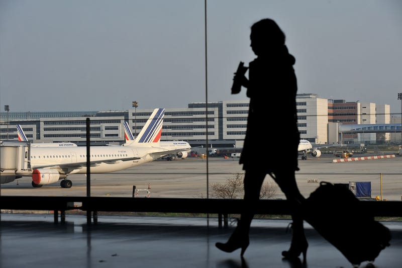 Passenger walks in a terminal at the Charles-de-Gaulle airport.