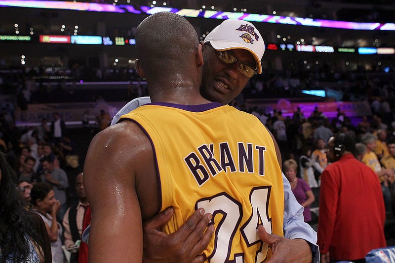 Joe Bryant hugs his son Kobe Bryant #24 of the Los Angeles Lakers after the Lakers 111-103 victory against the Utah Jazz during Game Two of the Western Conference Semifinals of the 2010 NBA Playoffs at Staples Center on May 4, 2010 in Los Angeles, California.