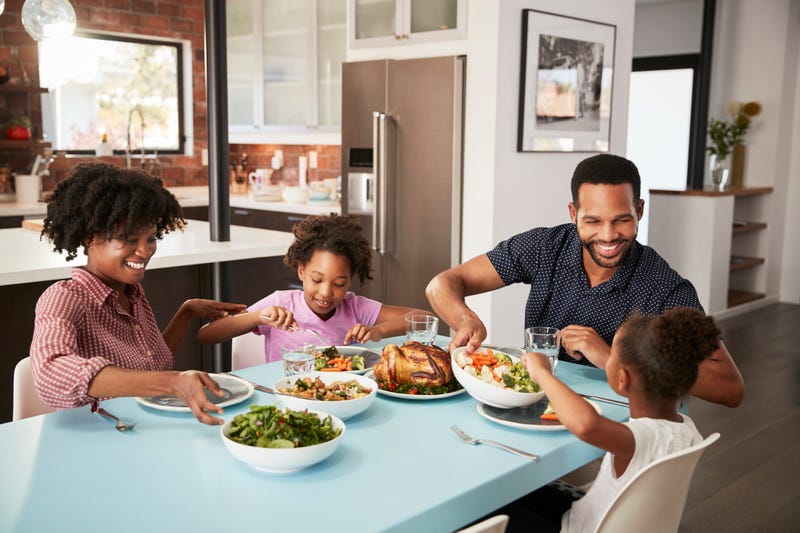 A family enjoying a meal together. 