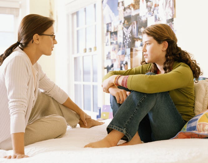 mom talking to teen 