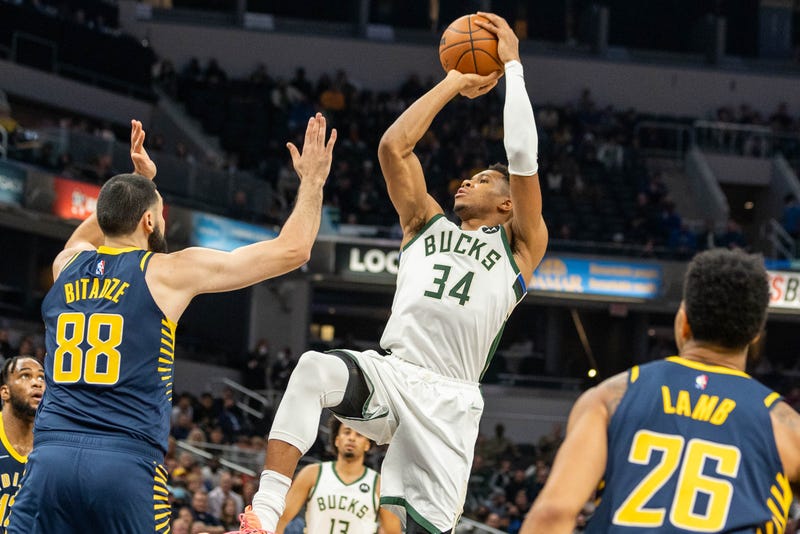 Oct 25, 2021; Indianapolis, Indiana, USA; Milwaukee Bucks forward Giannis Antetokounmpo (34) shoots the ball while Indiana Pacers center Goga Bitadze (88) defends in the second quarter at Gainbridge Fieldhouse. Mandatory Credit: Trevor Ruszkowski-USA TODAY Sports