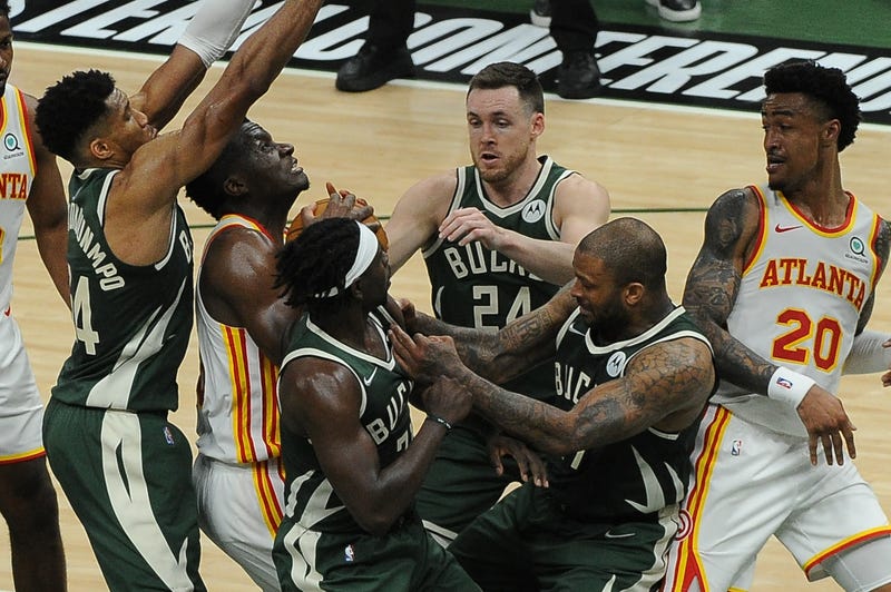Jun 23, 2021; Milwaukee, Wisconsin, USA; Atlanta Hawks center Clint Capela (15) and Milwaukee Bucks forward P.J. Tucker (17) battle for possession of the ball with under a minute to play in the fourth quarter during game one of the Eastern Conference Finals for the 2021 NBA Playoffs at Fiserv Forum. Mandatory Credit: Michael McLoone-USA TODAY Sports