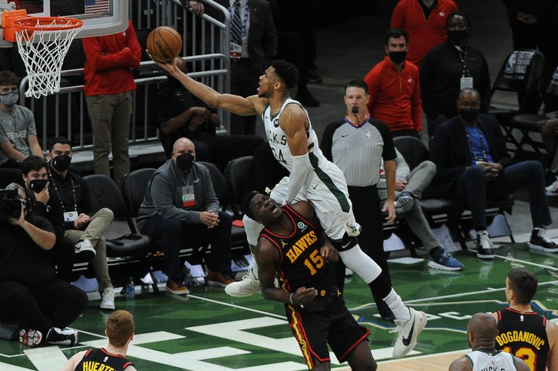 Jun 25, 2021; Milwaukee, Wisconsin, USA; Milwaukee Bucks forward Giannis Antetokounmpo (34) drives to the basket against Atlanta Hawks center Clint Capela (15) n the third quarter during game two of the Eastern Conference Finals for the 2021 NBA Playoffs at Fiserv Forum. Mandatory Credit: Michael McLoone-USA TODAY Sports