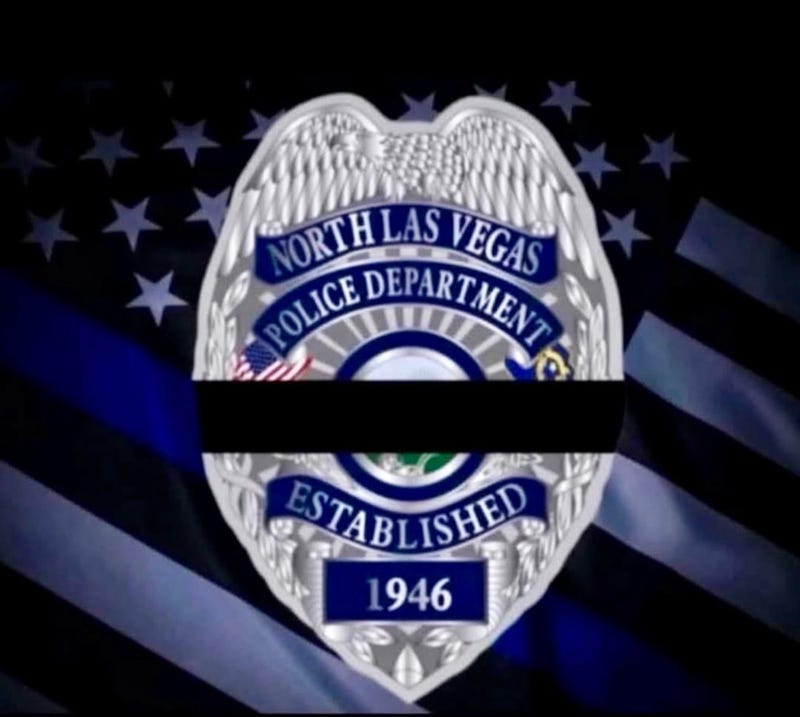 A black band around a North Las Vegas Police badge signifies a fallen officer